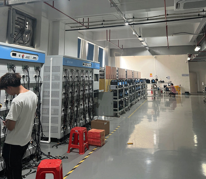 iFORWAY burn-in room with rows of aging test racks and units under test